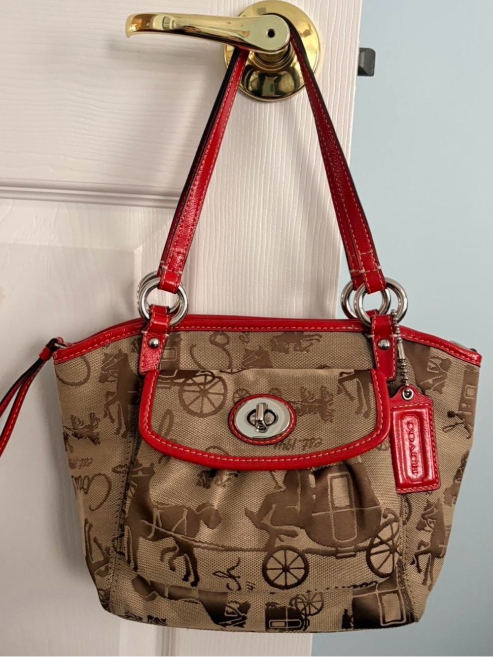 2009 Coach "Leah" satchel in the iconic Horse and Carriage heritage print.